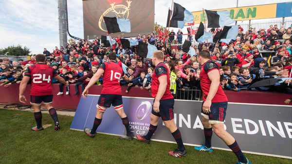 Munster players acknowledge a group of Shannon fans after the game