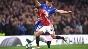 Mata takes on Chelsea defender Gary Cahill at Stamford Bridge