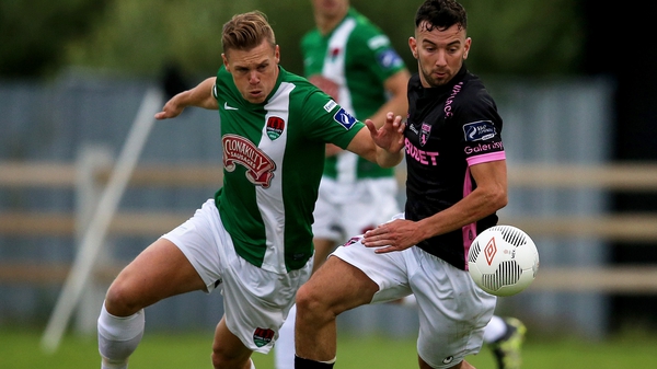 Cork CIty's Ian Turner battles for possession with Wexford's Shane Dunne