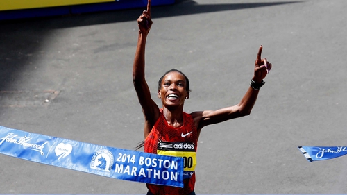 Rita Jeptoo crosses the finish line at the Boston Marathon