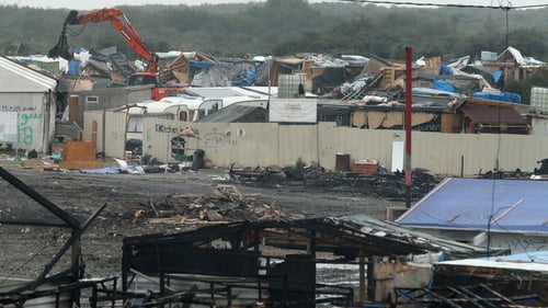 The remaining structure at the Calais camp are being torn down