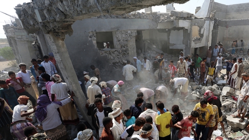 People search through the rubble after the attack