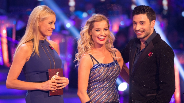 Laura Whitmore (centre) with professional partner Giovanni Pernice and Strictly host Tess Daly - 