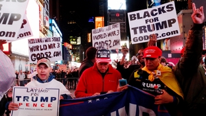 Supporters of Donald Trump shout slogans as they gather around Times Square
