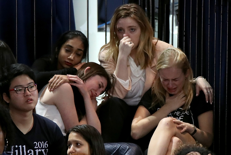 Clinton supporters react with shock as Hillary Clinton trails in the count