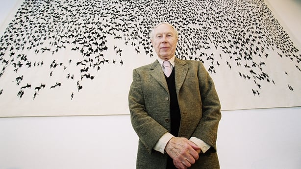 Louis le Brocquy in front of his tapestry 'The Táin, Maxwell Photography, 2000.