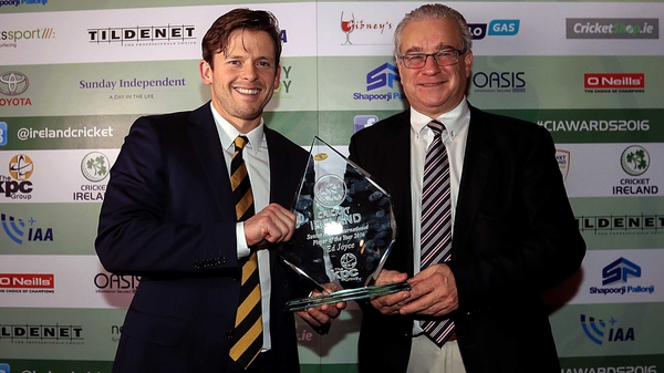 Ed Joyce receives the award from Cricket Ireland chairman Ross McCollum