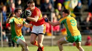 Corofin's Gary Sice and Ronan Steede try to tackle Barry Moran in last year's final