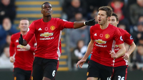 Paul Pogba and Michael Carrick celebrate the Frenchman's goal against Swansea