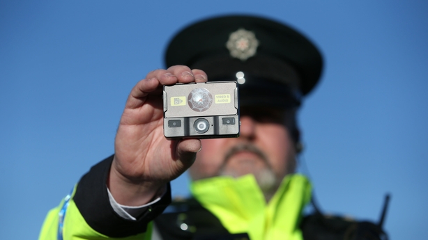 PSNI Inspector Alan Swan holds a body worn camera