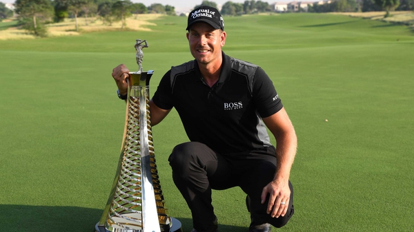 Henrik Stenson poses with the Race to Dubai trophy
