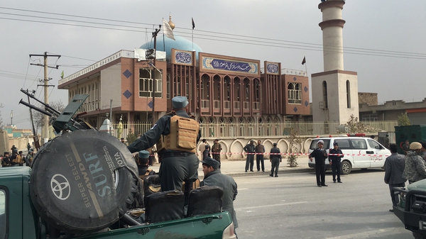 Afghan security officers cordoned off the area around the Baqirul Olum mosque
