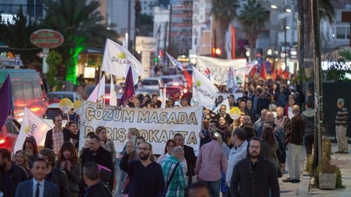 Protesters and peace activists take part in a peace rally in the northern part of Nicosia, in the self proclaimed Turkish Republic of Northern Cyprus