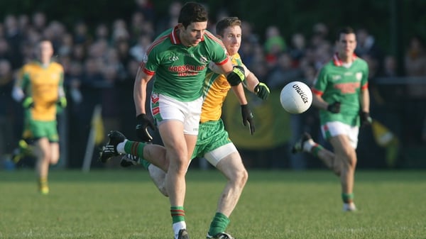 Corofin's Gary Sice (R) attempts to tackle Karol Mannion of St Brigid's in 2011