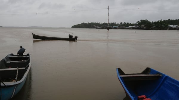 A man in his boat before Hurricane Otto hit Nicaragua