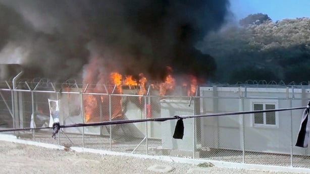 Greece: 2 dead as fire rages through refugee camp