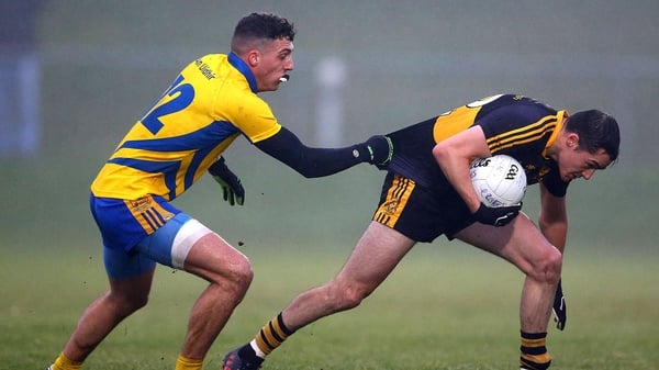 Dr. Crokes' Brian Looney is tackled by Shane Ryan of The Nire