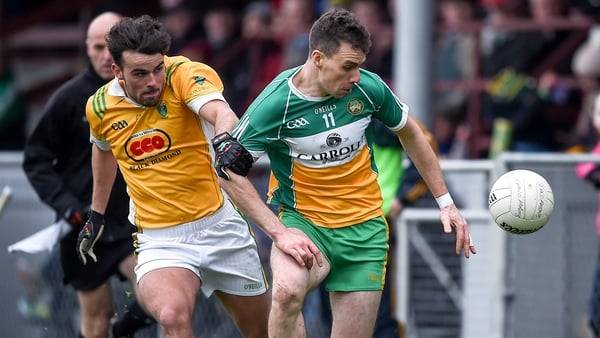 Rhode's Niall McNamee (right) proved the difference between the two sides, scoring eight points for the Offaly champions