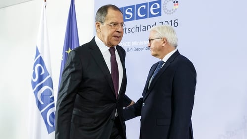 Sergei Lavrov (L) at the OSCE summit in Hamburg, Germany