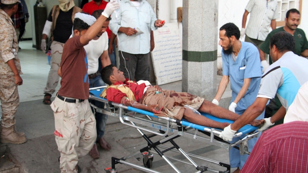 A wounded man arrives at hospital after the suicide bomb attack in Yemen's southern city of Aden