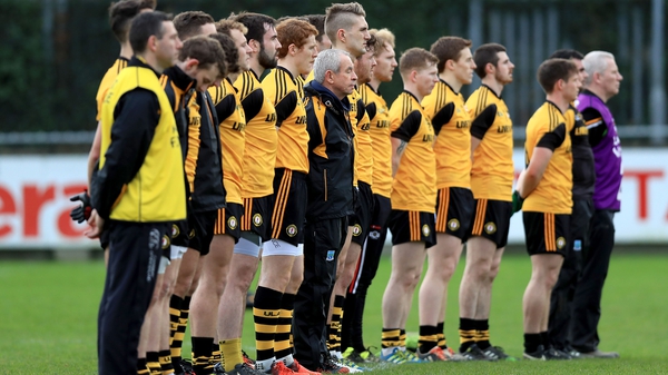 Ulster manager Pete McGrath stands with his team for a minute's silence in memory of former Ulster secretary Danny Murphy