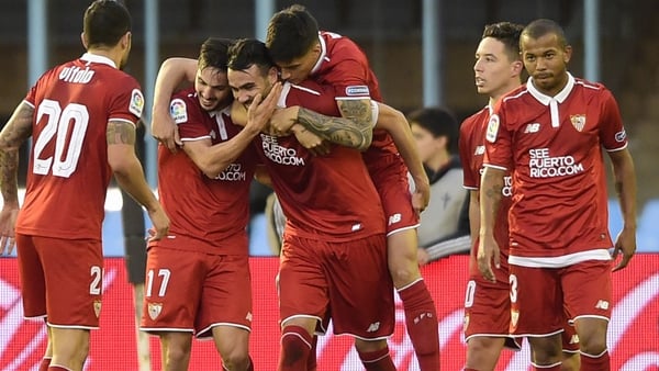 Vicente Iborra is mobbed by his Sevilla team-mates