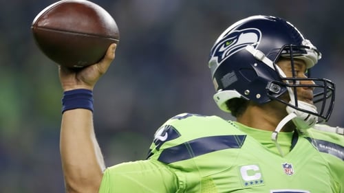 Russell Wilson throws a pass against the Los Angeles Rams at CenturyLink Field