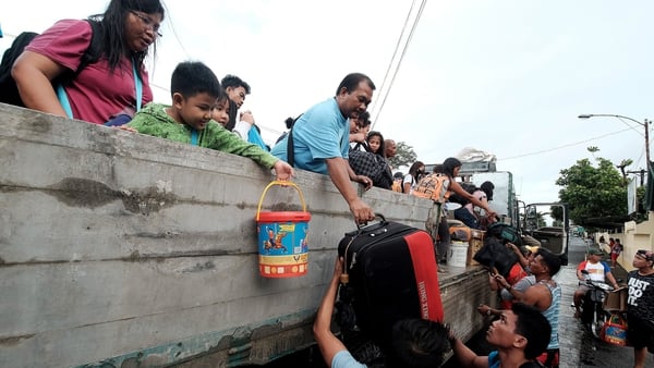 Stranded passengers from Tabaco port are evacuated by the local government in Tabaco City