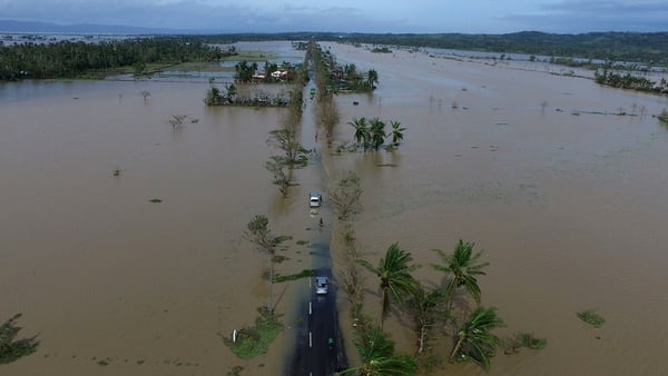 An aerial photo shows a flooded highway after typhoon Nock-Ten made landfall in Albay province