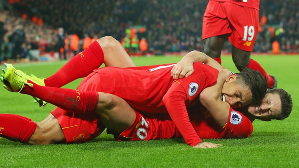 Firmino and Lallana celebrate a goal against Stoke City