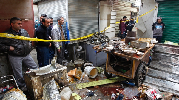 Police said the blasts went off near car spare parts shops in Sinak during the morning rush