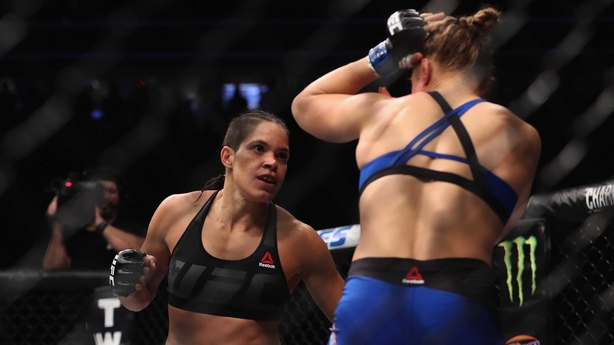 Amanda Nunes (L) put pressure on from the off