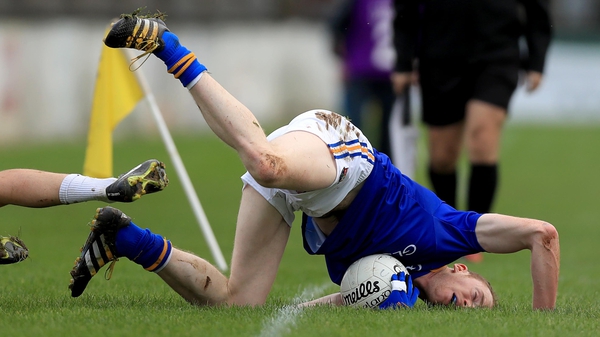 Longford's Barry O'Farrell falls face first after being tackled by a Kildare player