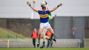 Kerry midfielder Brian O'Seanachain battles for possession with Tipperary's Martin Dunne