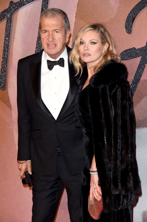 Kate Moss will always be the ultimate supermodel in our eyes . Kate walks the red carpet with Mario Testino wearing a velvet black gown.