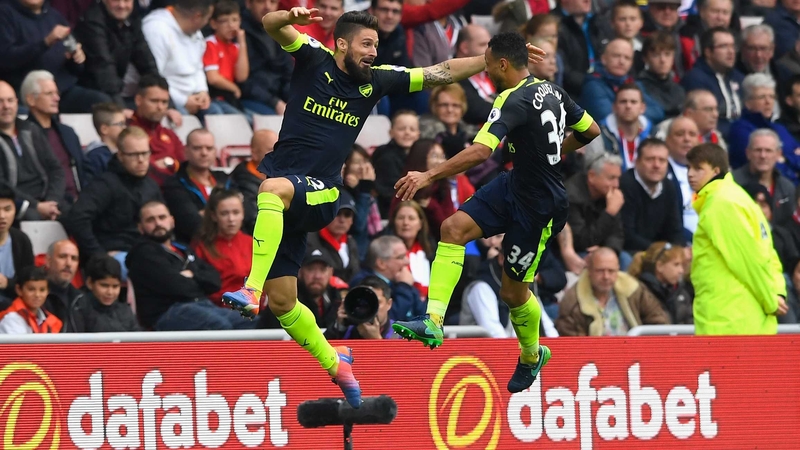 Olivier Giroud and Francis Coquelin celebrate a goal against Sunderland