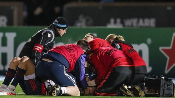 Conor Murray is treated by medical staff on the pitch