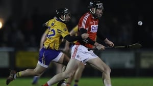 Clare's Cathal O'Connell chases Cork defender Mark Ellis