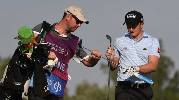 Paul Dunne (R) is six off the lead at the Qatar Masters