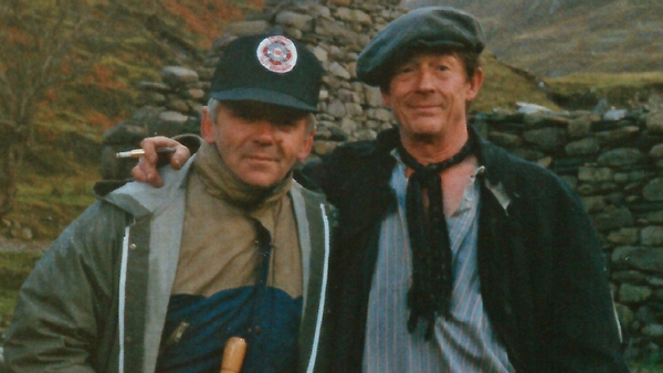 The two Johns, Hurt and Markey, pictured on location for Jim Sheridan's The Field (1990)