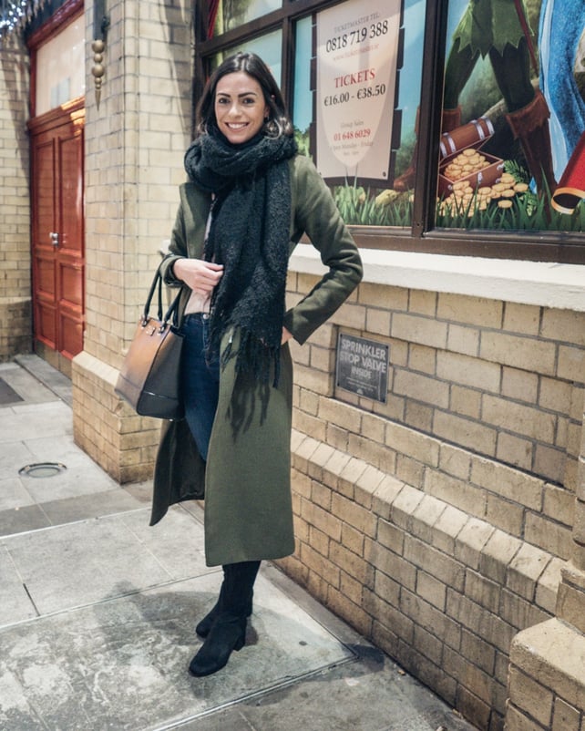 Josie McManus: The over-the-knee boot trend continues and Josie effortlessly pairs hers with jeans, a long coat and oversized scarf