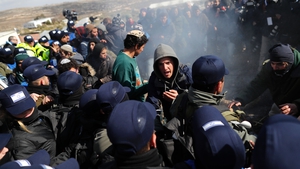 Israeli settlers scuffle with security forces at the Amona outpost