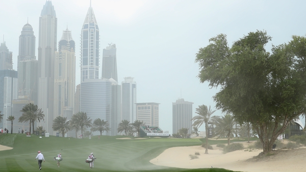 Strong winds create a mini-sandstorm on the eighth hole at Emirates Golf Club
