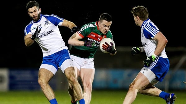 Mayo's Stephen Coen with Neil McAdam of Monaghan at MacHale Park