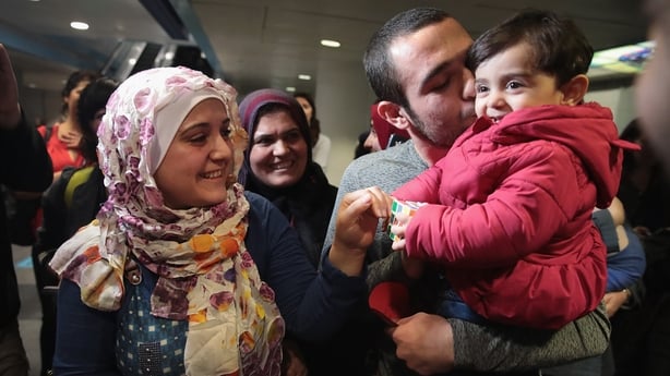Syrian refugees Baraa Haj Khalaf (L) and her daughter Shams arrive in the US after the travel ban was suspended