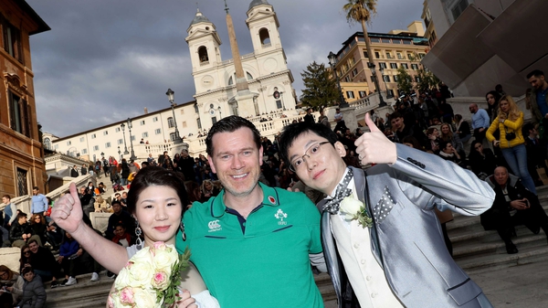 Ireland fan Dave Sheehan with a bride and groom at the Spanish Steps in Rome