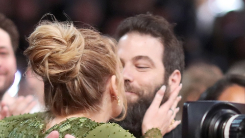 Adele had a kiss for her "husband" at the Grammys last night