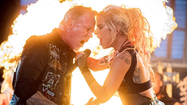 Metallica frontman James Hetfield sharing Lady Gaga's mic after his own failed