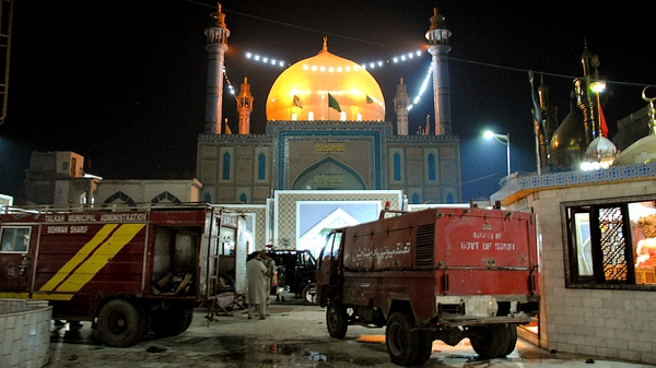 Bombing at crowded Sufi shrine also left dozens wounded