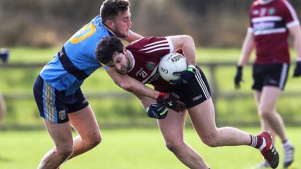 St Mary's Ciaran Mac Iomhar is tackled by Andy McDonnell of UCD
